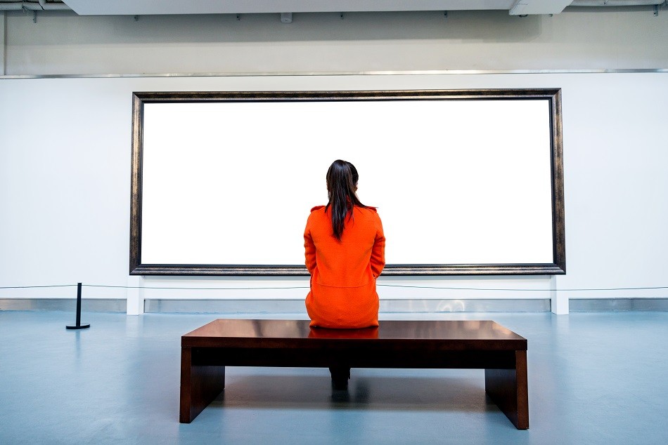Picture of a woman looking at a blank canvas
