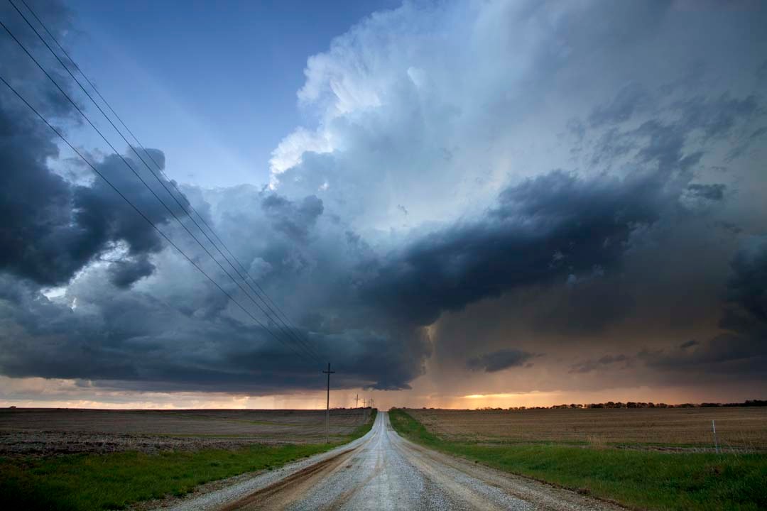 Picture of a road leading into a storm 