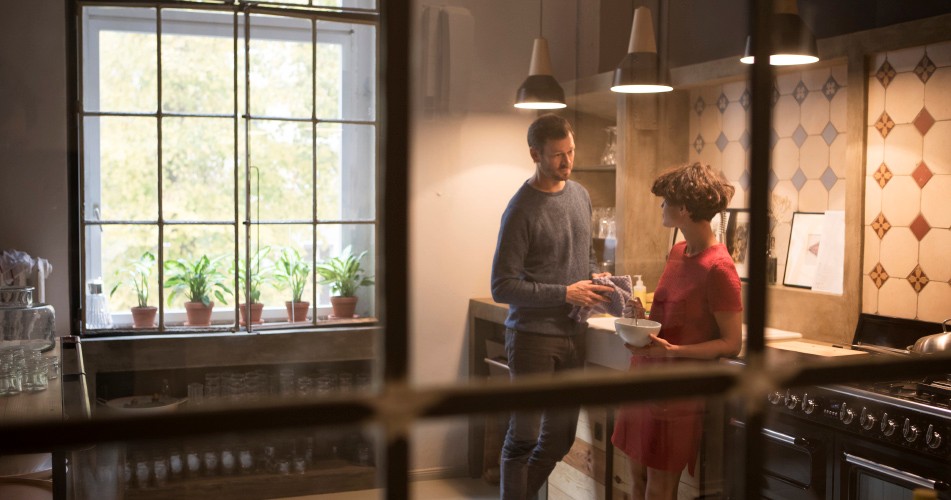 Picture of a couple talking in a kitchen