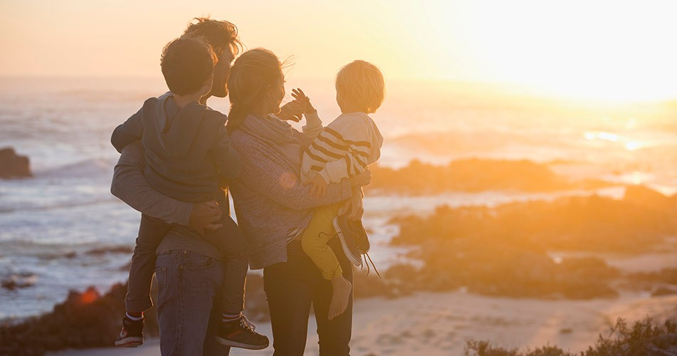 Picture of a family at sunset on a beach