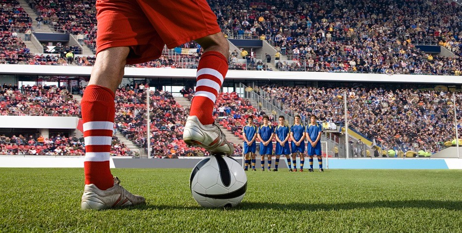 Picture of a footballer preparing a free kick