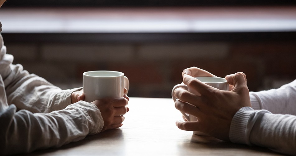 Picture of two people holding mugs