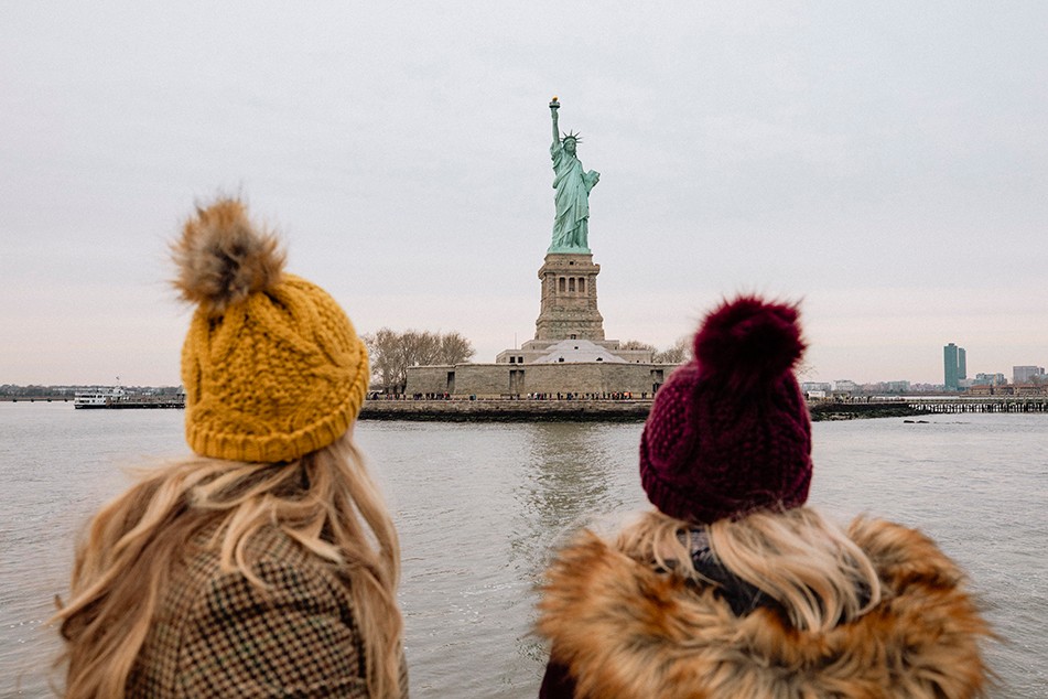 Picture of two woman looking at the statue of liberty