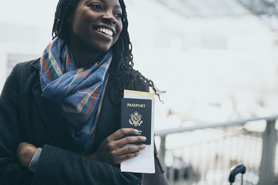 Picture of a woman holding a passport