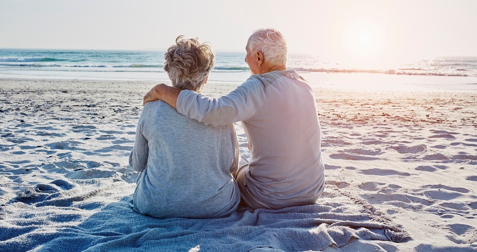 Picture of an elderly couple on the beach