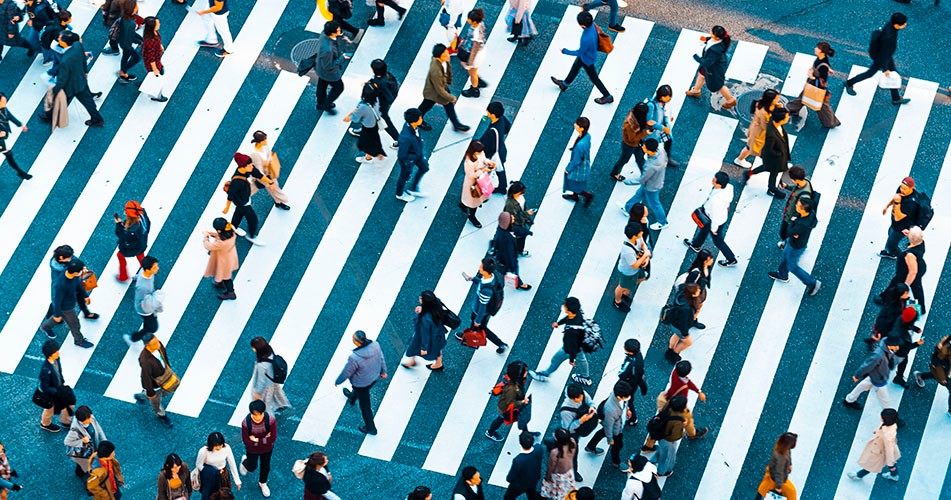 Picture of multiple people crossing a street