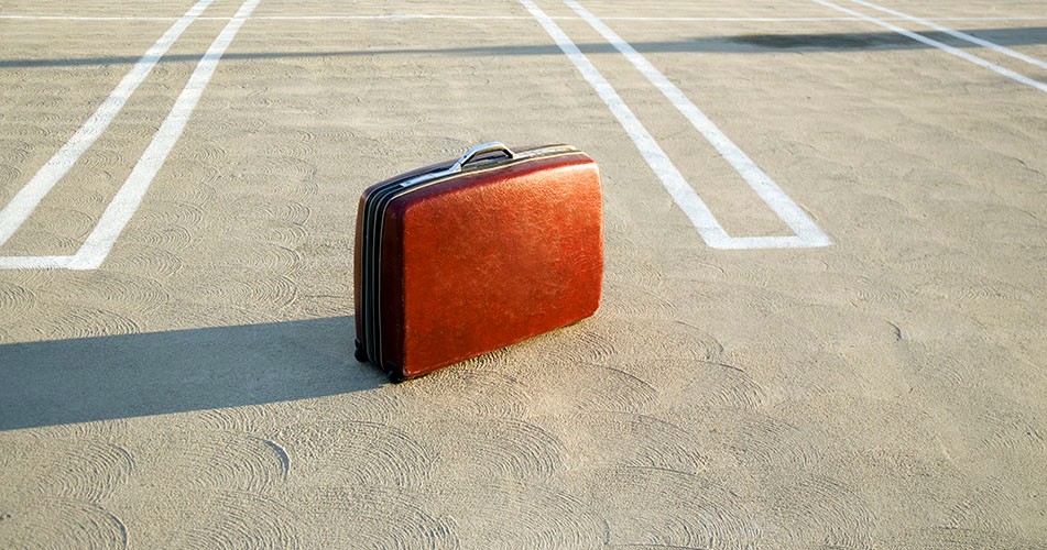 Picture of a briefcase in a parking area