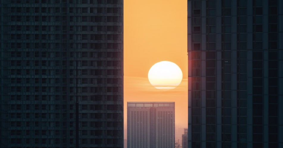 Picture of a sunset between buildings