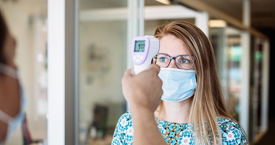 Picture of a woman having a temperature check