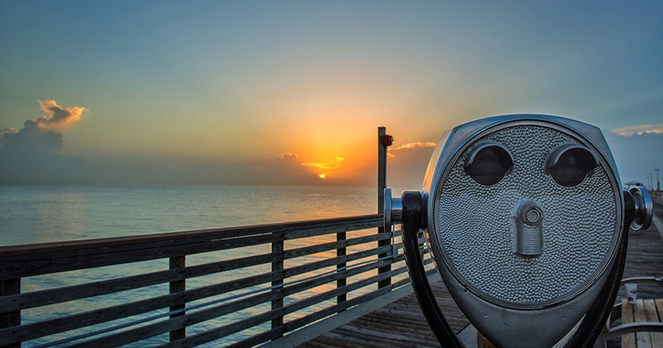 Picture of binoculars looking onto the sea front
