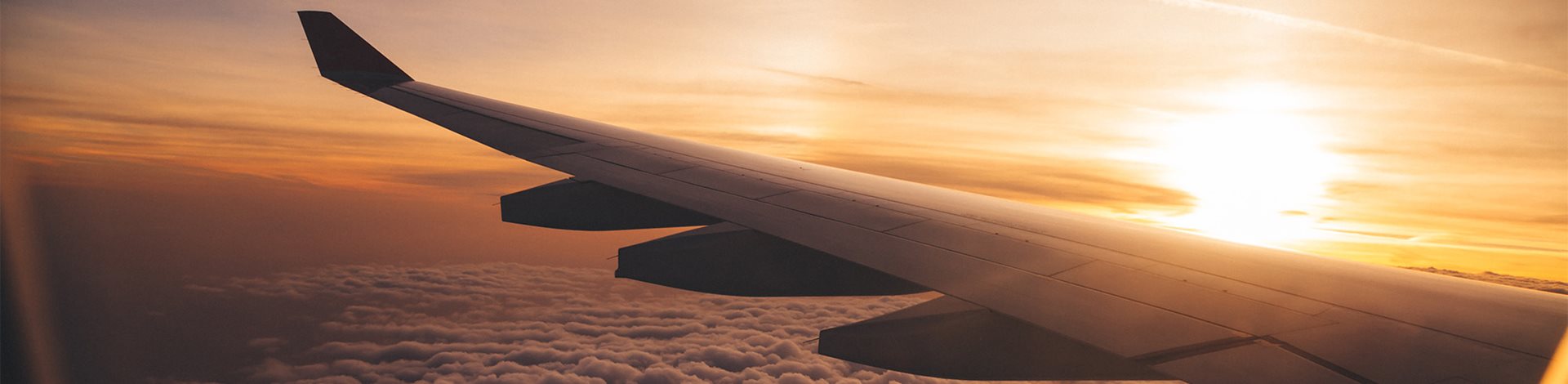 View of plane wing from window during flight