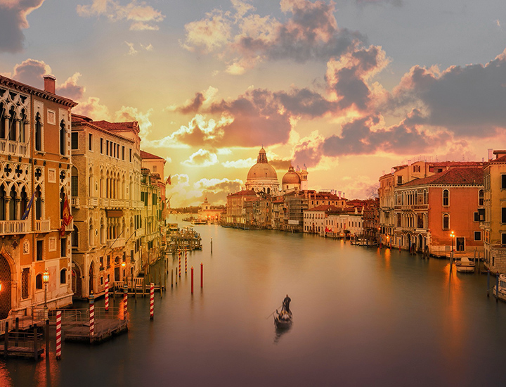 A gondola on the Grand Canal in Venice at sunset