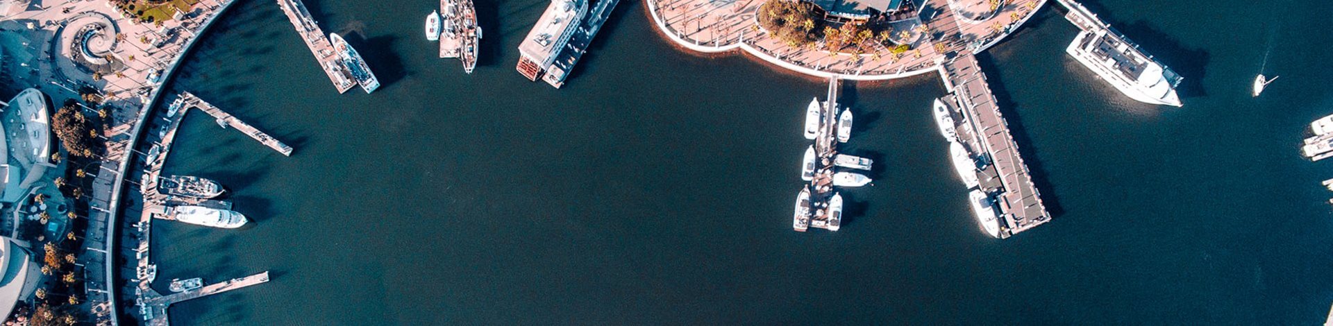 Bird's eye view of small harbour next to beach