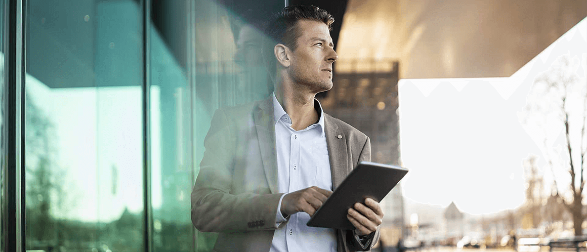 business man holding ipad 