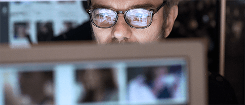 Man on laptop researching