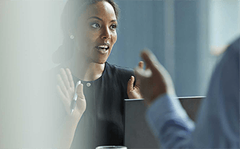 Woman speaking in business meeting