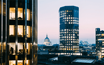 Woman standing on balcony of luxury hotel