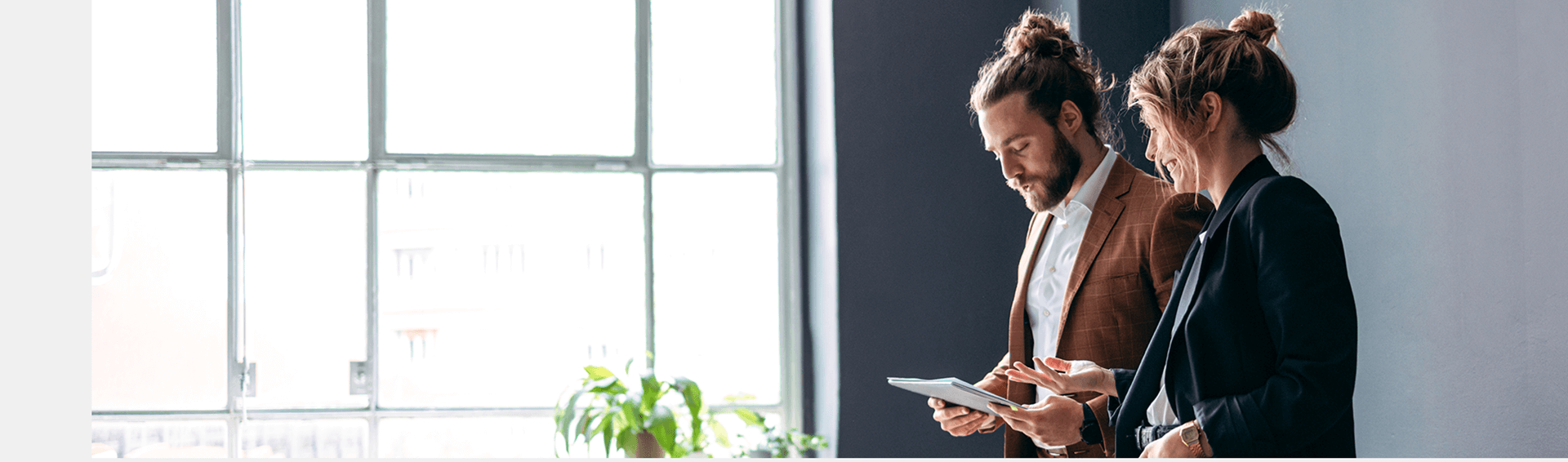 Couple sitting together looking at a phone