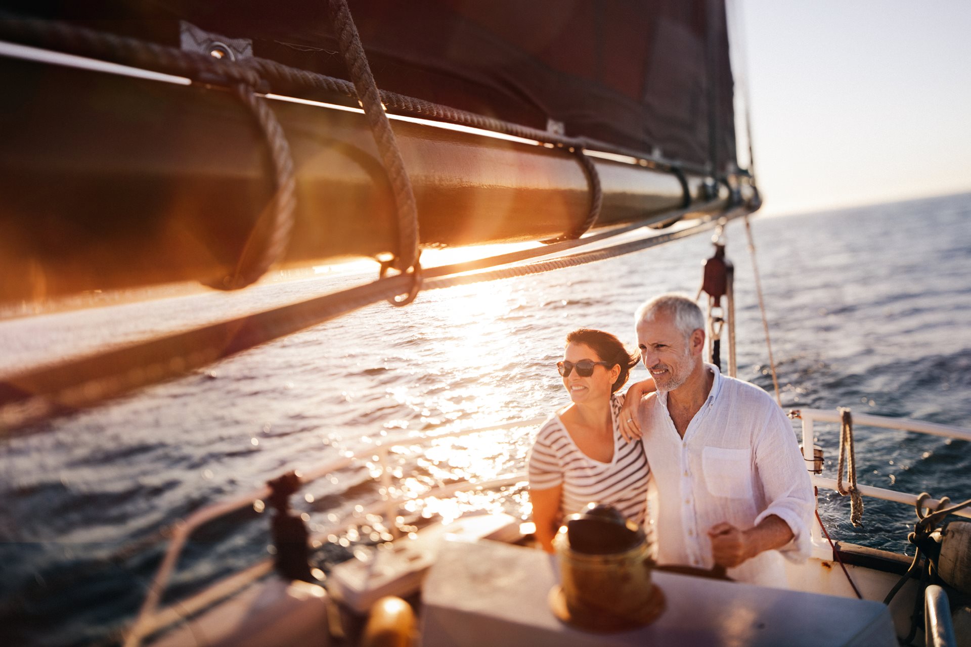 Senior couple enjoying leisure cruise on small boat