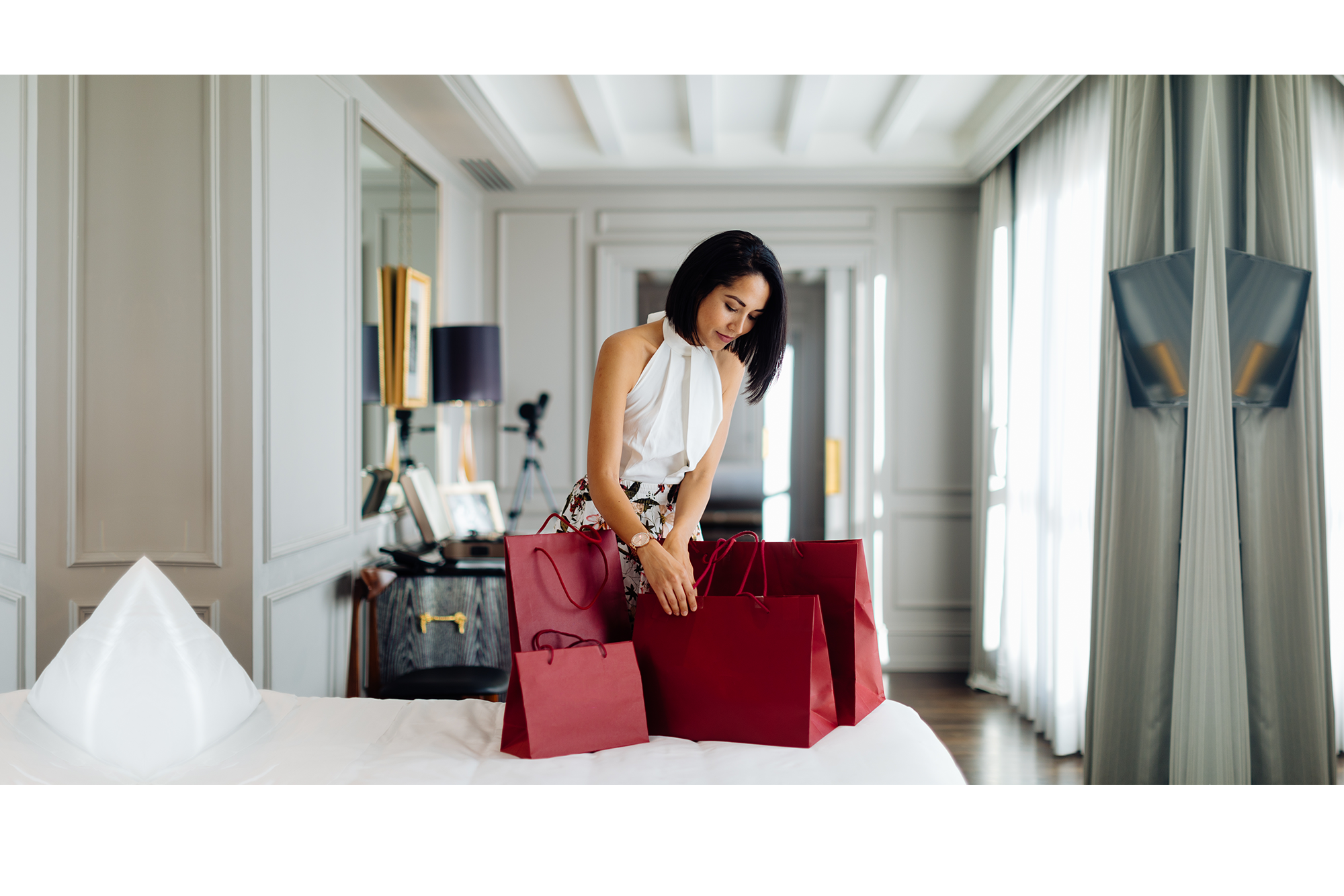 Woman opening red bags