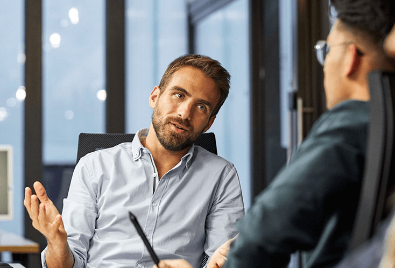 Man mentoring in work setting