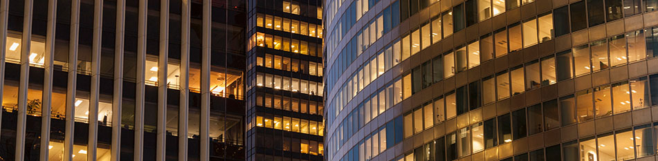 Close-up of office buildings at night
