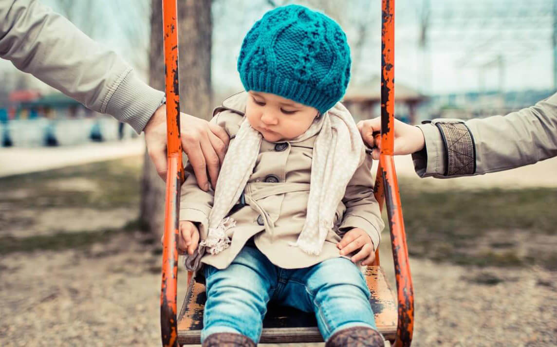 Picture of a young child on a swing