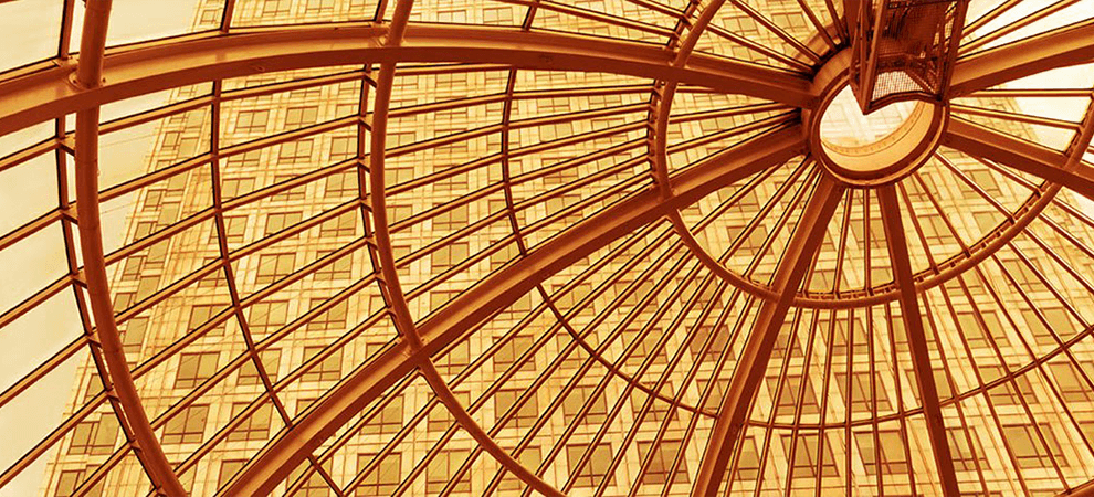 Office building through glass dome roof