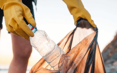 Person putting plastic water bottle into bin